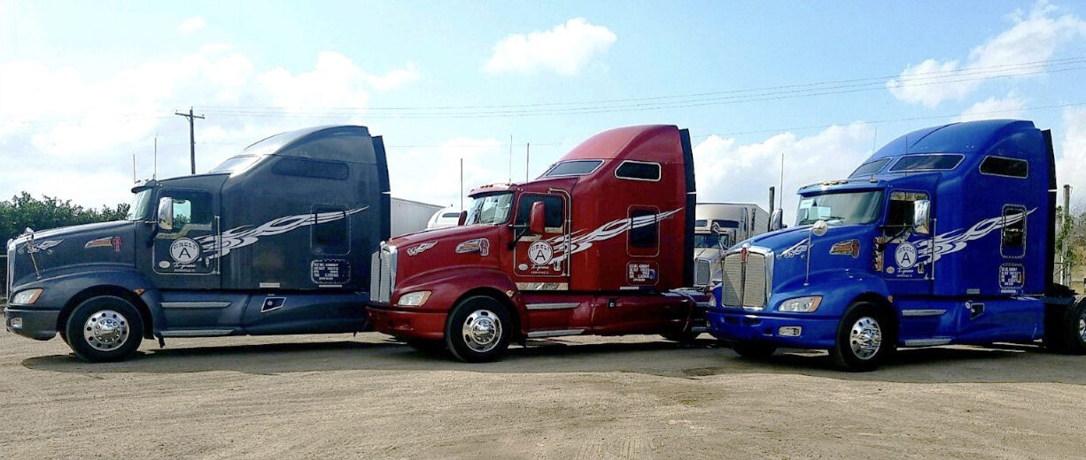3 semi-truck cabs parked next to each other